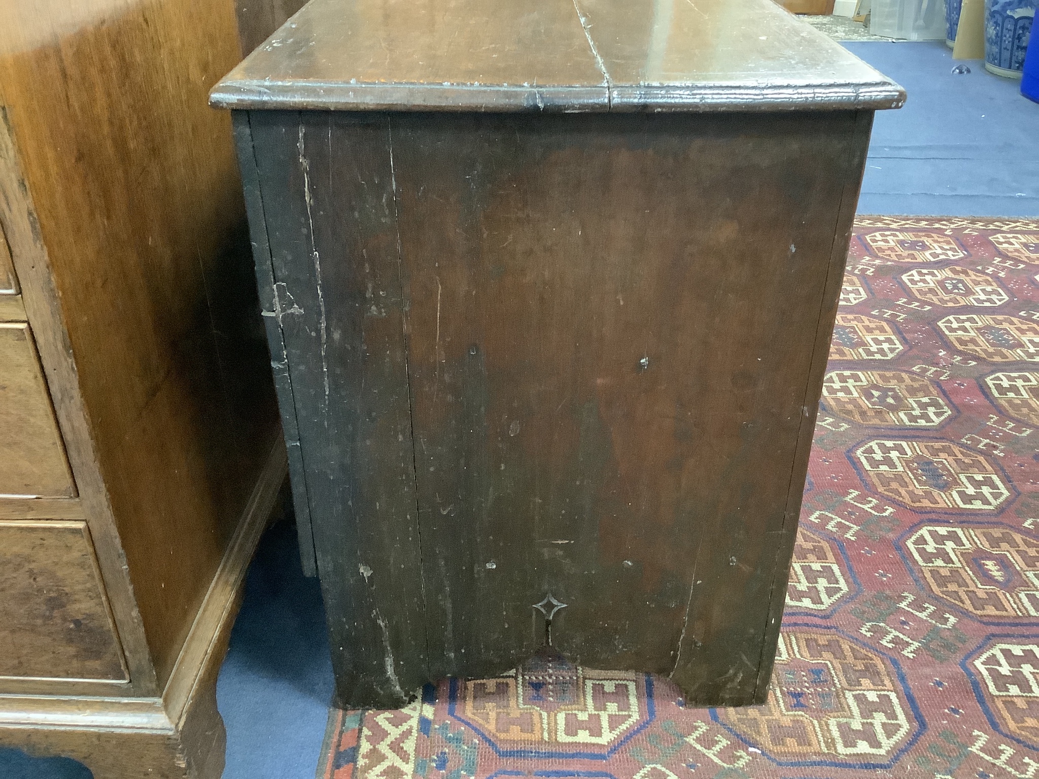 A 17th century carved boarded and panelled oak chest with rectangular moulded top, length 97cm, depth 48cm, height 64cm